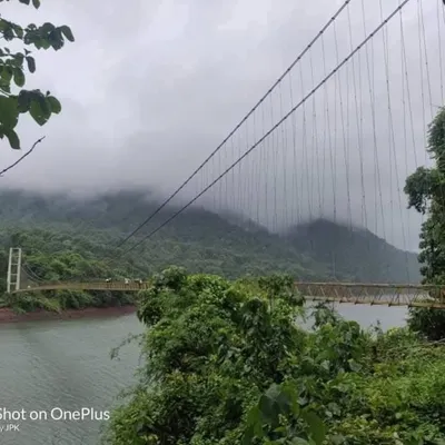 The Shivapura Hanging Bridge, a thrilling part of our Yallapura exploration trip, surrounded by misty hills and dense forests.