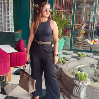 This is what I call power dressing. A sharp, all-black ensemble with a defined silhouette that's perfect for making a strong impression. This look combines a classic Zara top with Michael Kors and Coach accessories for effortless authority.