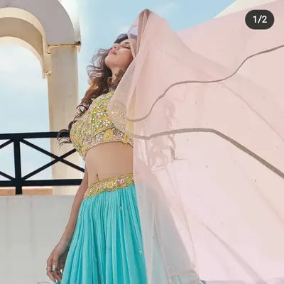 My makeup is designed to look amazing in any light, especially outdoors. This shot from a pre-wedding shoot shows how the makeup stays fresh and vibrant under the sun. The flowing dupatta adds a dynamic feel, and the makeup complements the bright, happy mood perfectly.