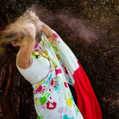 The pure joy of Holi captured in a burst of color. Action shots like this are the heart of a themed shoot, creating dynamic and unforgettable images that are full of life and energy.