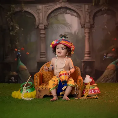 Your little one will look divine as baby Krishna, seated on a miniature throne with a colorful turban and peacock feather. The setup includes a pot of butter and other traditional props.