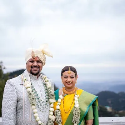A majestic portrait of the couple against the backdrop of the Mussoorie hills. This is what destination wedding photography is all about.