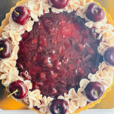 Experience the perfect harmony of flavors in my Cherry Cheesecake Tart. A buttery crust holds a creamy cheesecake filling, topped with a sweet cherry compote and fresh cherries.