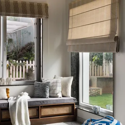 This cozy window seat is the perfect reading nook. I designed it with built-in storage underneath, featuring cane webbing for texture. It’s a simple addition that provides extra seating and a quiet corner to unwind.