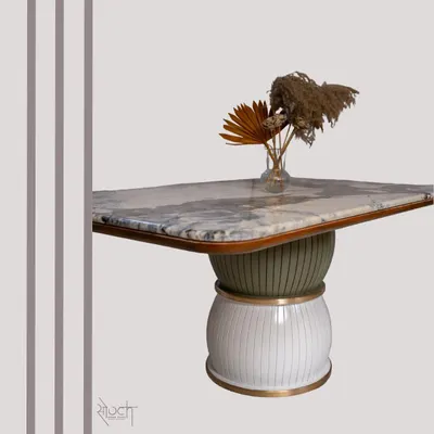 The "Damru" dining table, inspired by the musical instrument, stands on two spheres with a stunning Brazilian Quartzite top. This piece is a perfect example of how I blend cultural inspiration with modern design to create functional art.