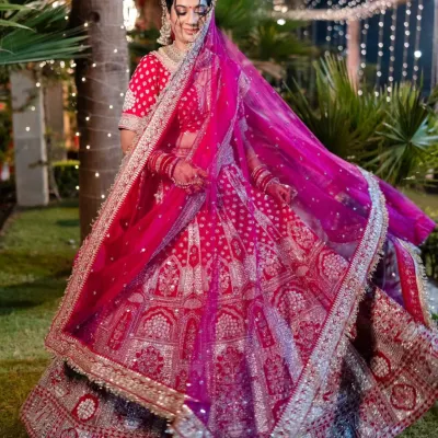 This stunning bride is glowing in one of our pre-loved bridal lehengas. We love the intricate silver embroidery on the vibrant pink fabric, perfect for making a grand entrance on your big day. You don't need to spend a fortune to get your dream wedding look.