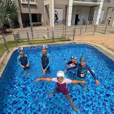 Our swimming classes are about building TRUST and creating WAVES of confidence! Look at these happy swimmers.