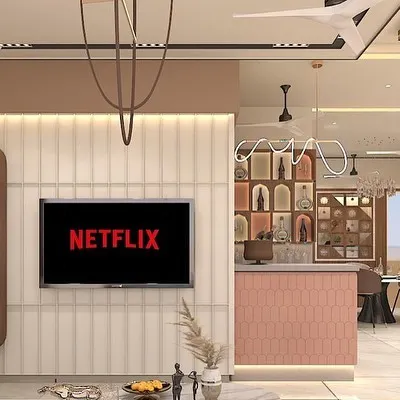 This is a 3D design concept we created for an upcoming bungalow project. It shows the living area with a fluted TV panel, a bar counter with pink tiles, and a view into the dining space, helping the client visualize the open and connected layout.