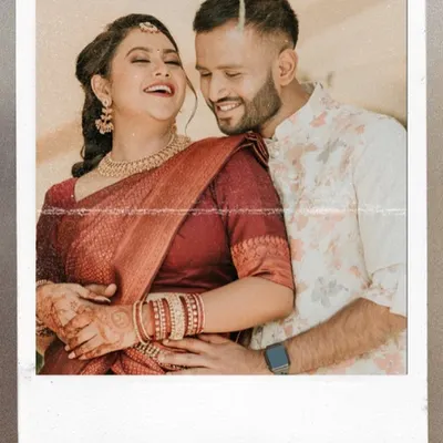 A candid, joyful moment between a couple, captured in a polaroid-style frame. The genuine laughter makes this a precious memory.