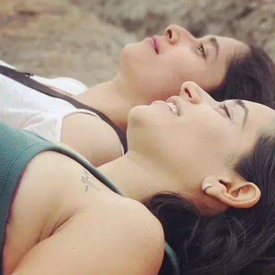 A moment of complete surrender and relaxation with a dear friend after a practice. This is the goal of Shavasana: to let go, breathe, and simply be.