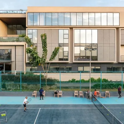 An overview of the Koramangala Club annexe, a 100-meter-long addition that provides new recreational facilities. The design mirrors the existing block structure to create a seamless integration between old and new.