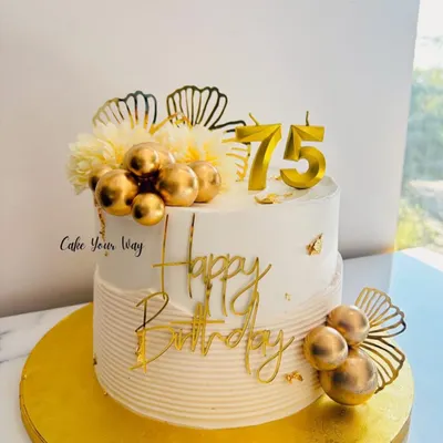 A golden celebration for 75 golden years. This elegant white and gold cake is perfect for a milestone birthday.