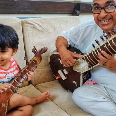My Baba, my first Guru, sharing his love for the sitar with my young nephew. This is how the journey begins, with curiosity and gentle guidance, and I welcome students as young as six to start their own musical path.