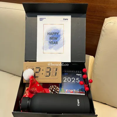 Kicking off the New Year with a stylish gift for Cipla employees. This hamper includes a branded bottle, a 2025 calendar, a digital clock, and festive decorations.