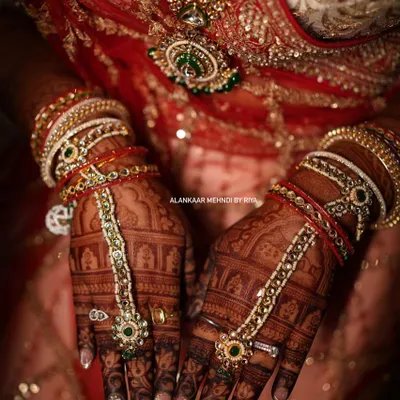 This is the result of my organic henna. A stunningly dark stain, beautifully accessorized with bridal jewelry, showcasing the richness of the color.