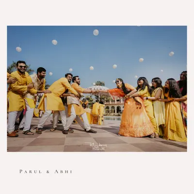 The ultimate battle of the sexes. This fun-filled tug of war between the bride's and groom's sides is a perfect example of the candid, chaotic joy I love to capture at Haldi ceremonies.