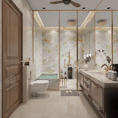 Each bathroom we design has its own personality. This one features golden aesthetics, with floor-to-ceiling marble, brass fittings, and a luxurious built-in bathtub, creating a spa-like atmosphere of pure elegance and opulence.