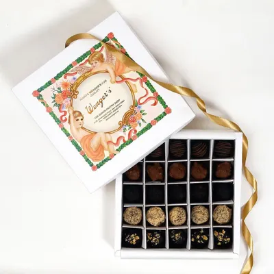 Our signature assorted chocolate box, featuring a variety of handmade pralines and truffles. It’s the perfect gift for any chocolate lover, presented in our classic Wenger's box.