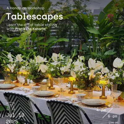 The poster for our hands-on 'Tablescapes' workshop with stylist Pratiksha Kataria. The image showcases a beautifully set table in a lush, green setting, inviting you to learn how to turn your own parties into visual art.