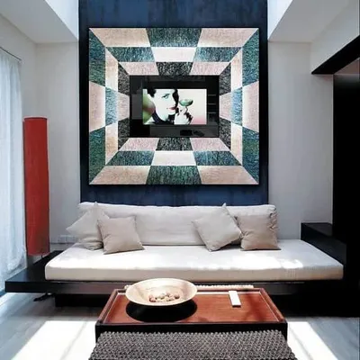 This is not a painting; it's a high-definition television. We installed this Adnotam mirror TV, which is concealed behind a custom mother-of-pearl frame. It serves as a beautiful piece of wall art until you turn it on, offering the ultimate in discreet home entertainment technology.