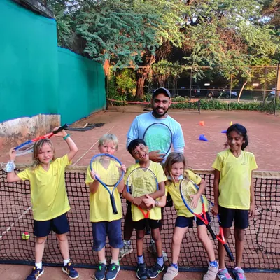 A happy group from my mini tennis program. I use age-appropriate racquets and a fun-first approach to introduce the sport to young children.