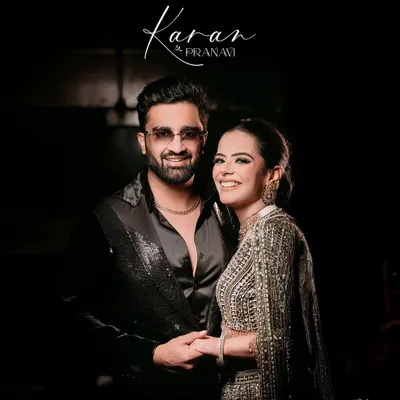 A classic, smiling portrait of the couple at their cocktail night, perfectly capturing the glamour and happiness of the evening.