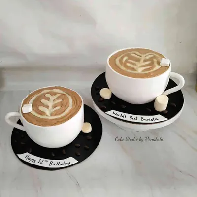 Care for a cup of coffee? Or two? These are actually cakes I designed to look like coffee cups with latte art, perfect for a barista or coffee lover.