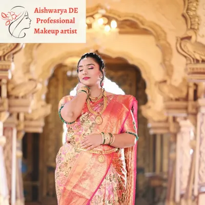 A beautiful portrait of a South Indian bride, showcasing the harmony between the makeup and the rich tissue silk saree. The look is completed with layered gold necklaces and a traditional waist belt.
