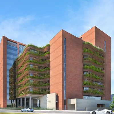 We envision hospitals as ecosystems of healing, where architecture and nature converge. This design for Peerless Hospital in Kolkata features a vertical green skin, creating a biophilic facade that offers visual relief and an improved patient experience.