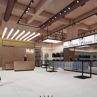 This is a look into an apparel store we designed in Noida, focusing on a raw, industrial aesthetic softened by earthy terracotta tones. The layout uses open display racks and strategic track lighting to create an inviting and modern retail experience.