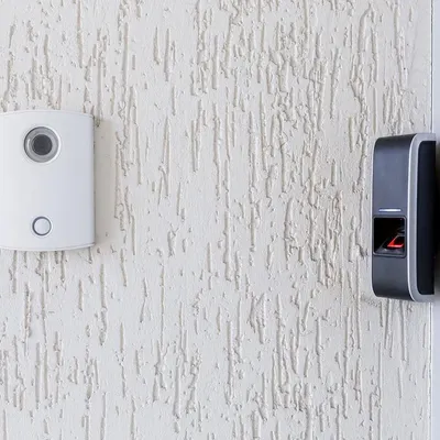 Here is an example of an integrated access solution we installed. It combines an audio-video communication unit with a biometric fingerprint scanner, providing two layers of verification for secure entry.