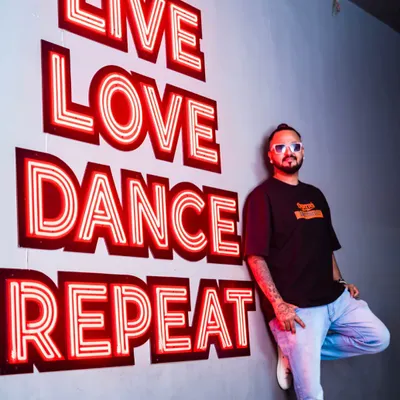 Live, Love, Dance, Repeat. This isn't just a sign on the wall; it's the motto I live by. This is me in my natural habitat.
