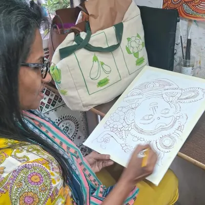 A student works on the intricate line work of a Kerala mural design. Our specialized workshops allow students to dive deep into traditional Indian art forms.