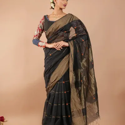 A full look featuring a Maheshwari silk cotton saree paired with one of our printed long-sleeve blouses.