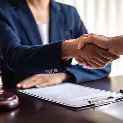 A handshake signifies a successful agreement, which must be legally sound. With Karnataka's mandate of a 0.5% stamp duty on sale agreements, I ensure all property transactions are compliant with the latest regulations to prevent future disputes.