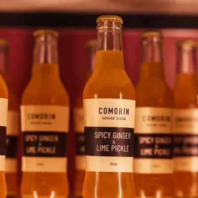 Our Spicy Ginger & Lime Pickle soda is a refreshingly unexpected choice. This house-made beverage offers a unique combination of heat from the ginger and tang from the lime pickle, creating a perfectly balanced drink.