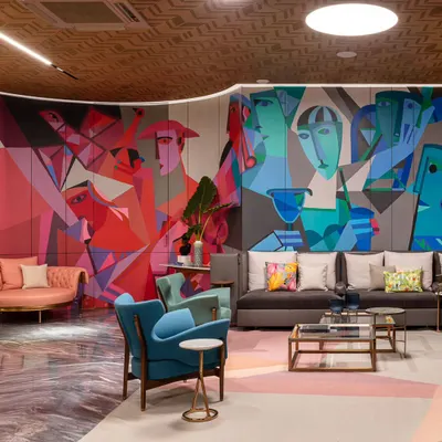'The ClanDestine House,' a project where we used art to give a home character and color. This mural, a fusion of cubist and abstract styles, brings a dynamic energy to the main lounge area.