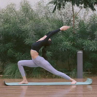 This is a variation of Veerabhadrasana, the Warrior Pose. It's a powerful asana that builds strength in the legs and core while opening the chest and shoulders. It’s a perfect example of how we combine stretching with strengthening.