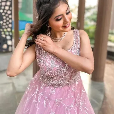 A close-up of the sparkling bodice on this pink gown. The intricate beadwork is designed to make you shine.