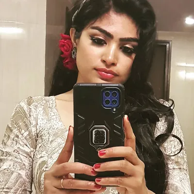 A fun retro-inspired look for an office event. I created dramatic winged eyeliner and paired it with a bold red flower for that classic old-Bollywood glamour.
