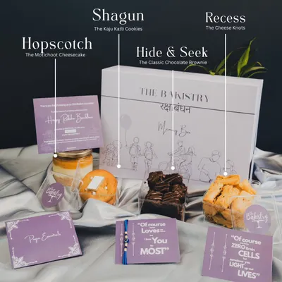 This is what's inside my Rakhi 'Memory Box'. It includes our fusion Motichoor Cheesecake, Kaju Katli cookies for that perfect *shagun*, classic brownies, savory Cheese Knots, an evil eye rakhi, and *pooja* essentials.