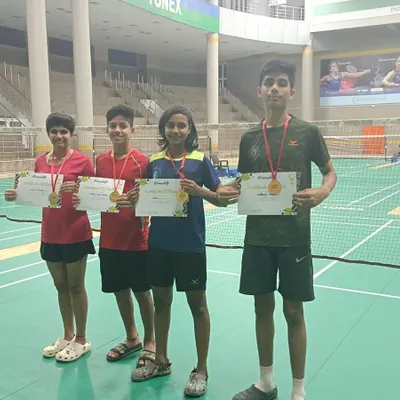 The success of our players is our greatest achievement. This image captures the pride and joy of our tournament winners, showcasing the results of their dedication and the high standard of coaching at our Noida academy.