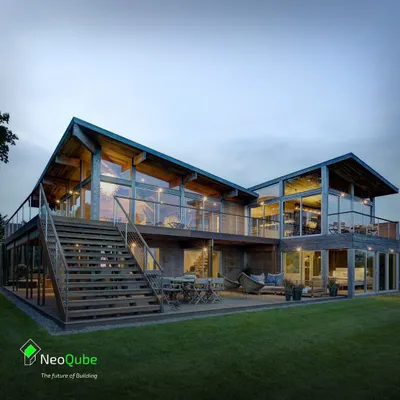 Imagine a luxurious, multi-level prefab home with soaring ceilings and glass walls that frame the landscape. This design concept embodies our vision for modern, sustainable luxury living.
