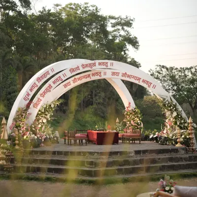 The 'Mantram' mandap was designed to feel like a blessing. The clean, modern arches inscribed with Sanskrit verses and framed by soft, romantic florals created a space that was both visually stunning and spiritually resonant.