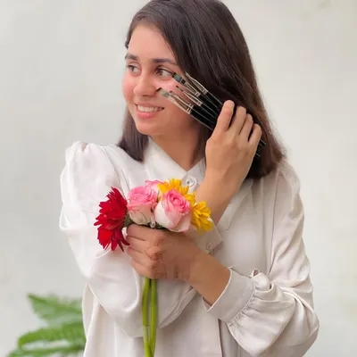 Lost in colors, searching for myself. This is me with the tools of my trade and the flowers that inspire me. Art is not just what I do, it's who I am.