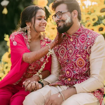 She brought sunshine with her smile, and I added just the right glow to match. This bride owned her haldi moment in style, sharing a playful moment with her groom.