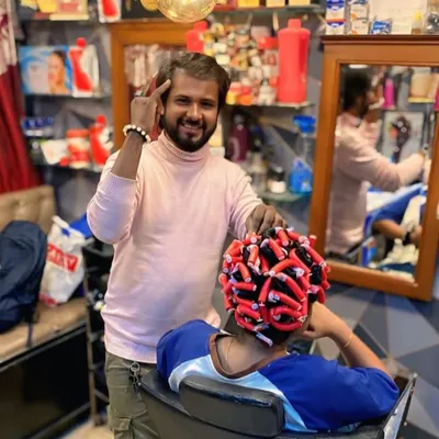 Here I am during the permanent curling process. The hair is carefully wrapped around curling rods before the solution is applied to set the new shape.