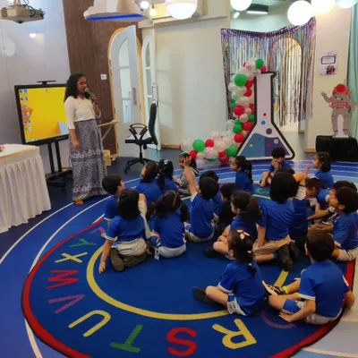 An instructor addresses a classroom of engaged preschoolers. We tailor our workshops to be age-appropriate, capturing the attention of even the youngest learners.