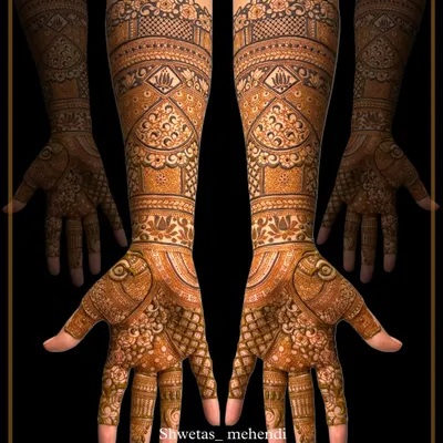 A perfect example of a heavy, traditional bridal mehendi. This symmetrical design is filled with intricate details, fine lines, and classic patterns for a timeless look.