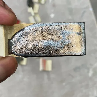 A close-up of a glaze test tile. This one developed a beautiful metallic, crystalline effect during firing. Testing is crucial for discovering new and exciting surfaces for my work.
